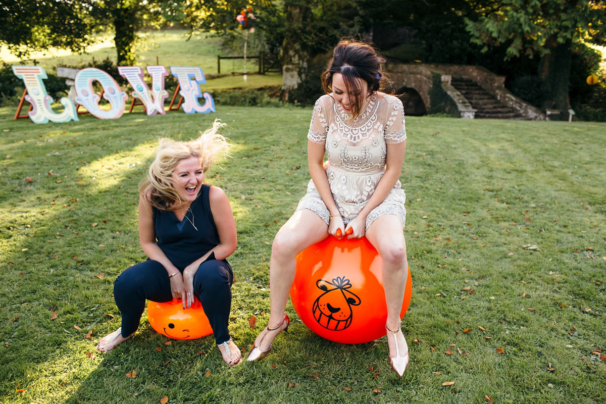 Emily wore a Needle & Thread dress for her colourful, balloon and glitter filled wedding at Coombe Trenchard. Images by Freckle Photography.