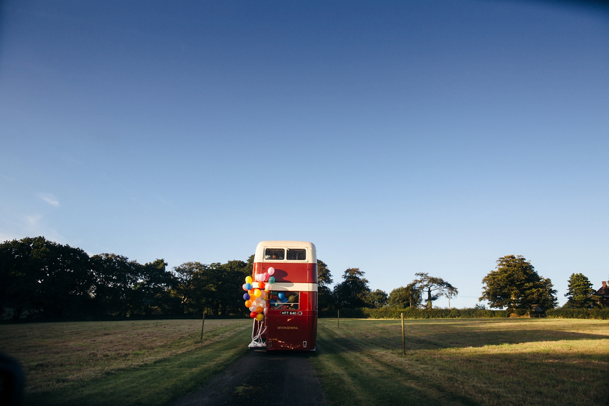 Emily wore a Needle & Thread dress for her colourful, balloon and glitter filled wedding at Coombe Trenchard. Images by Freckle Photography.