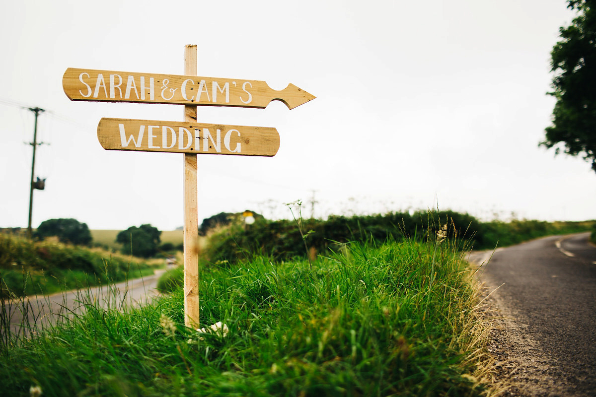 Sarah wore a Grace Loves Lace dress for her rustic Dorset barn wedding with paper cranes. Photography by Richard Skins.