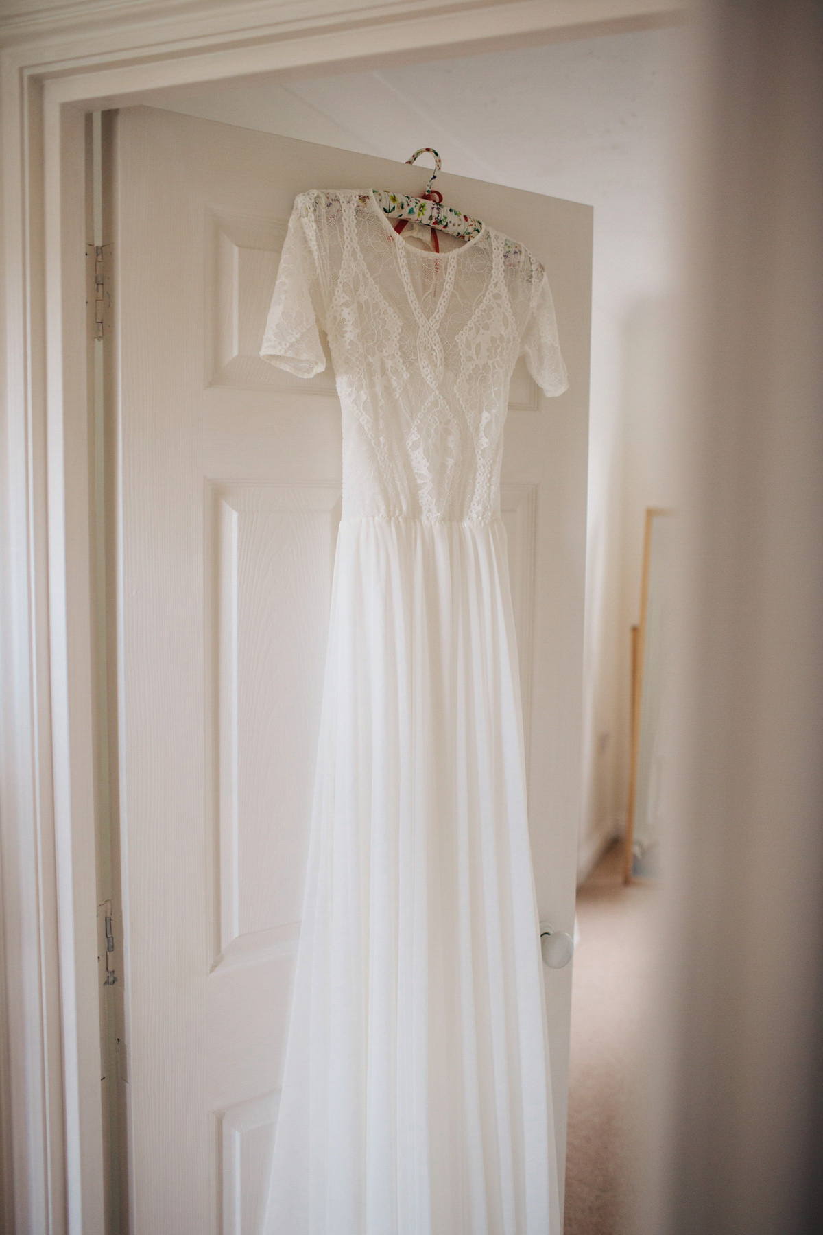 Sarah wore a Grace Loves Lace dress for her rustic Dorset barn wedding with paper cranes. Photography by Richard Skins.