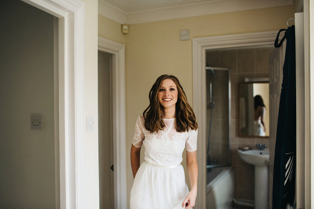 Sarah wore a Grace Loves Lace dress for her rustic Dorset barn wedding with paper cranes. Photography by Richard Skins.