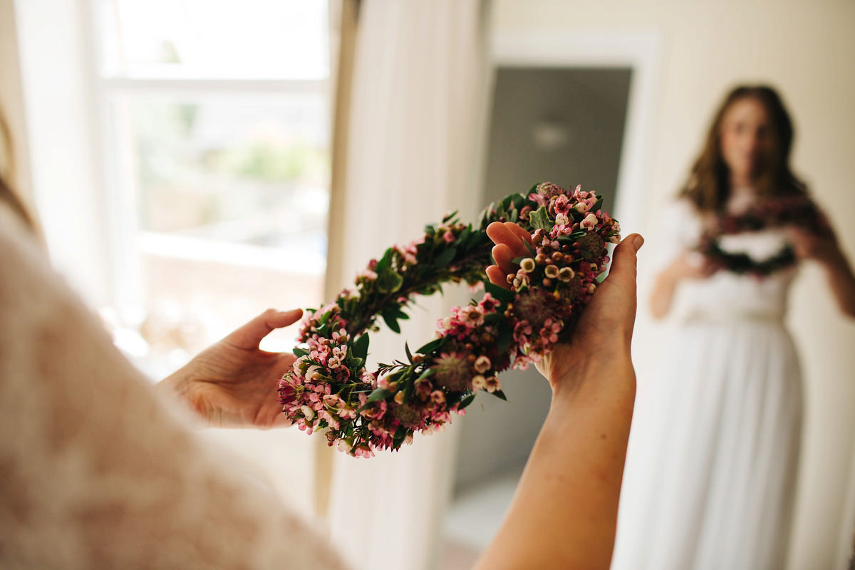 Sarah wore a Grace Loves Lace dress for her rustic Dorset barn wedding with paper cranes. Photography by Richard Skins.