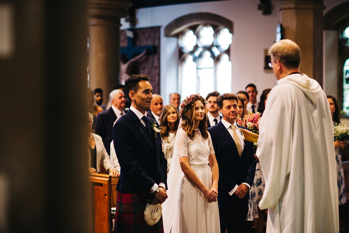 Sarah wore a Grace Loves Lace dress for her rustic Dorset barn wedding with paper cranes. Photography by Richard Skins.