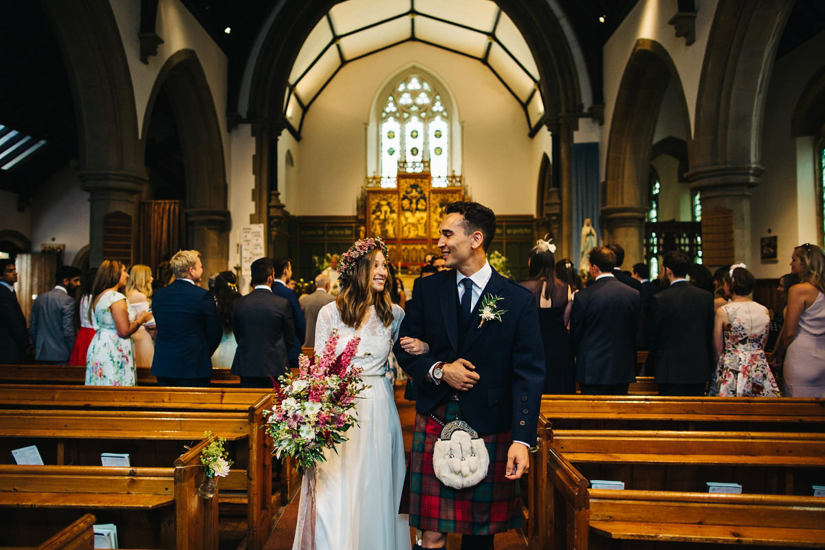 Sarah wore a Grace Loves Lace dress for her rustic Dorset barn wedding with paper cranes. Photography by Richard Skins.