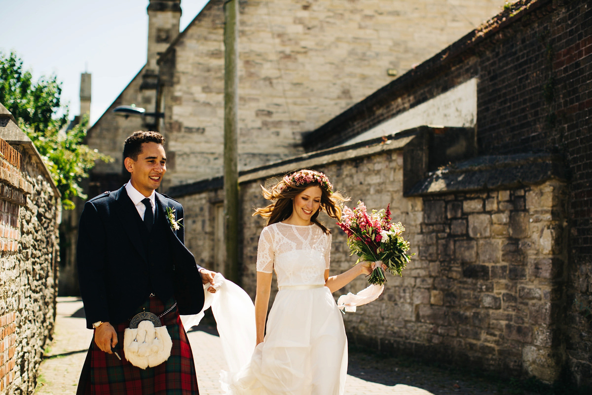 Sarah wore a Grace Loves Lace dress for her rustic Dorset barn wedding with paper cranes. Photography by Richard Skins.