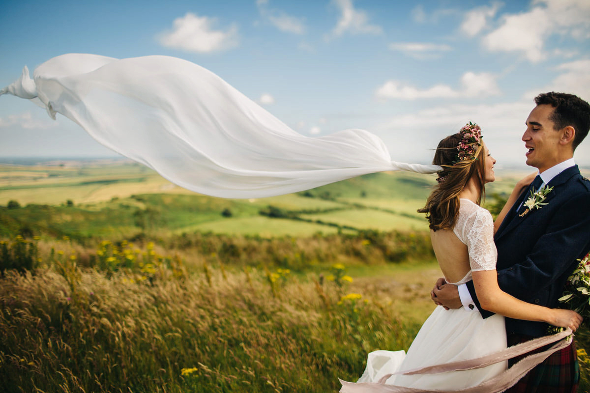 Sarah wore a Grace Loves Lace dress for her rustic Dorset barn wedding with paper cranes. Photography by Richard Skins.