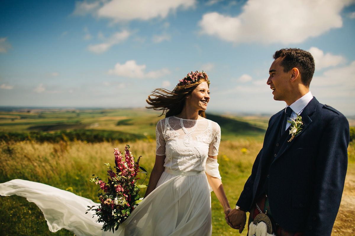 Sarah wore a Grace Loves Lace dress for her rustic Dorset barn wedding with paper cranes. Photography by Richard Skins.