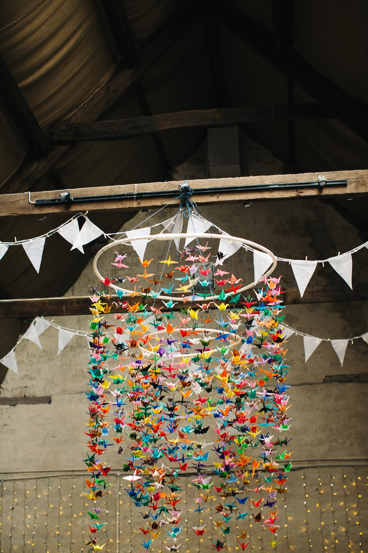 Sarah wore a Grace Loves Lace dress for her rustic Dorset barn wedding with paper cranes. Photography by Richard Skins.