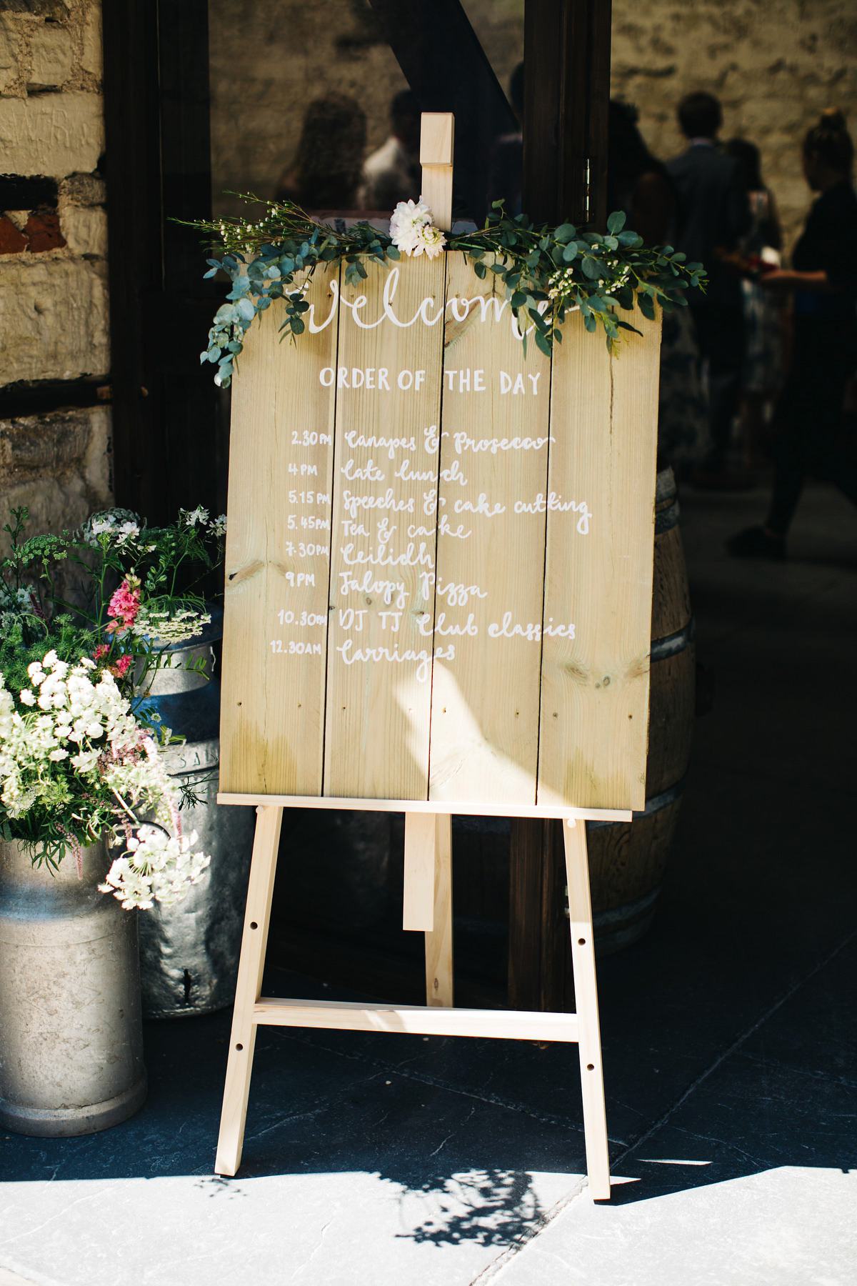 Sarah wore a Grace Loves Lace dress for her rustic Dorset barn wedding with paper cranes. Photography by Richard Skins.