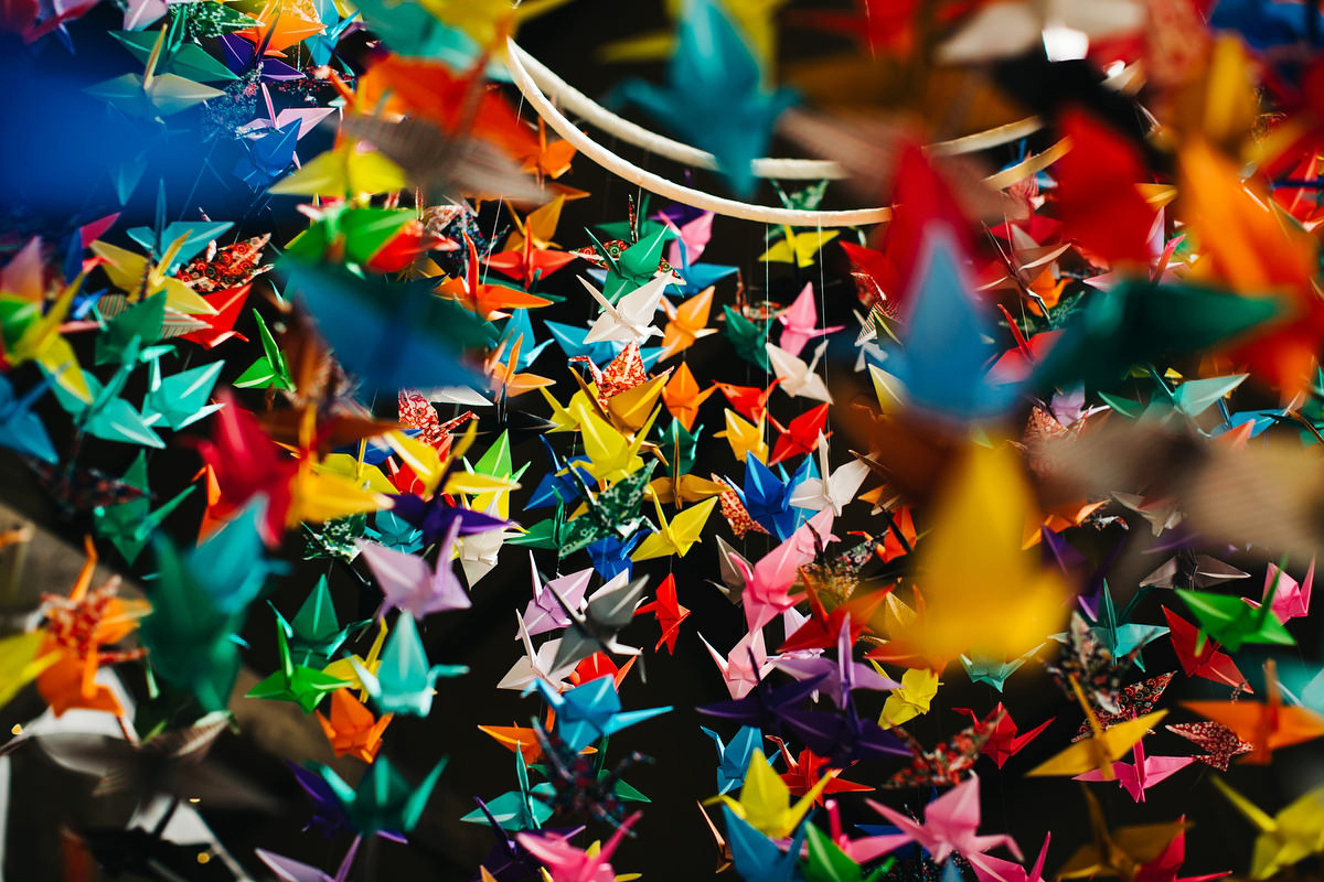 Sarah wore a Grace Loves Lace dress for her rustic Dorset barn wedding with paper cranes. Photography by Richard Skins.