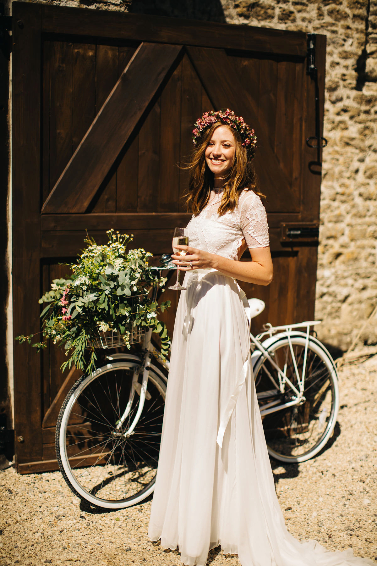 Sarah wore a Grace Loves Lace dress for her rustic Dorset barn wedding with paper cranes. Photography by Richard Skins.