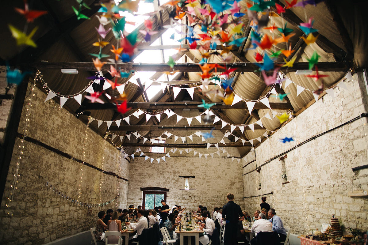 Sarah wore a Grace Loves Lace dress for her rustic Dorset barn wedding with paper cranes. Photography by Richard Skins.