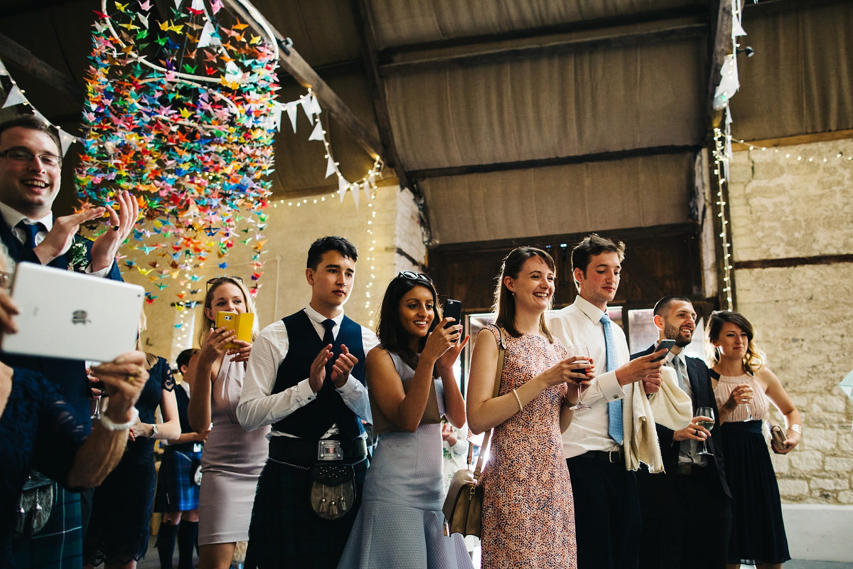 Sarah wore a Grace Loves Lace dress for her rustic Dorset barn wedding with paper cranes. Photography by Richard Skins.