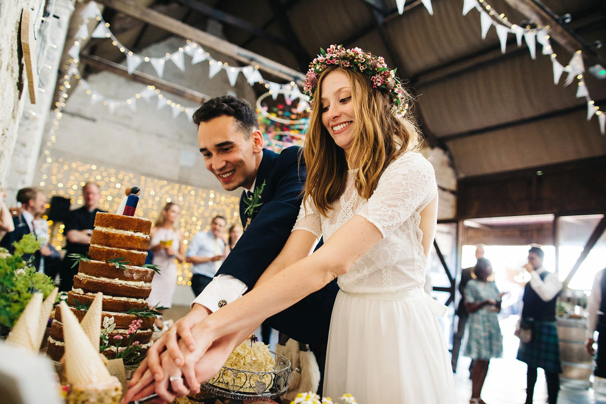 Sarah wore a Grace Loves Lace dress for her rustic Dorset barn wedding with paper cranes. Photography by Richard Skins.