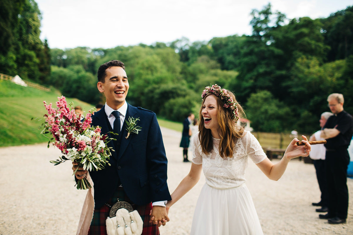 Sarah wore a Grace Loves Lace dress for her rustic Dorset barn wedding with paper cranes. Photography by Richard Skins.