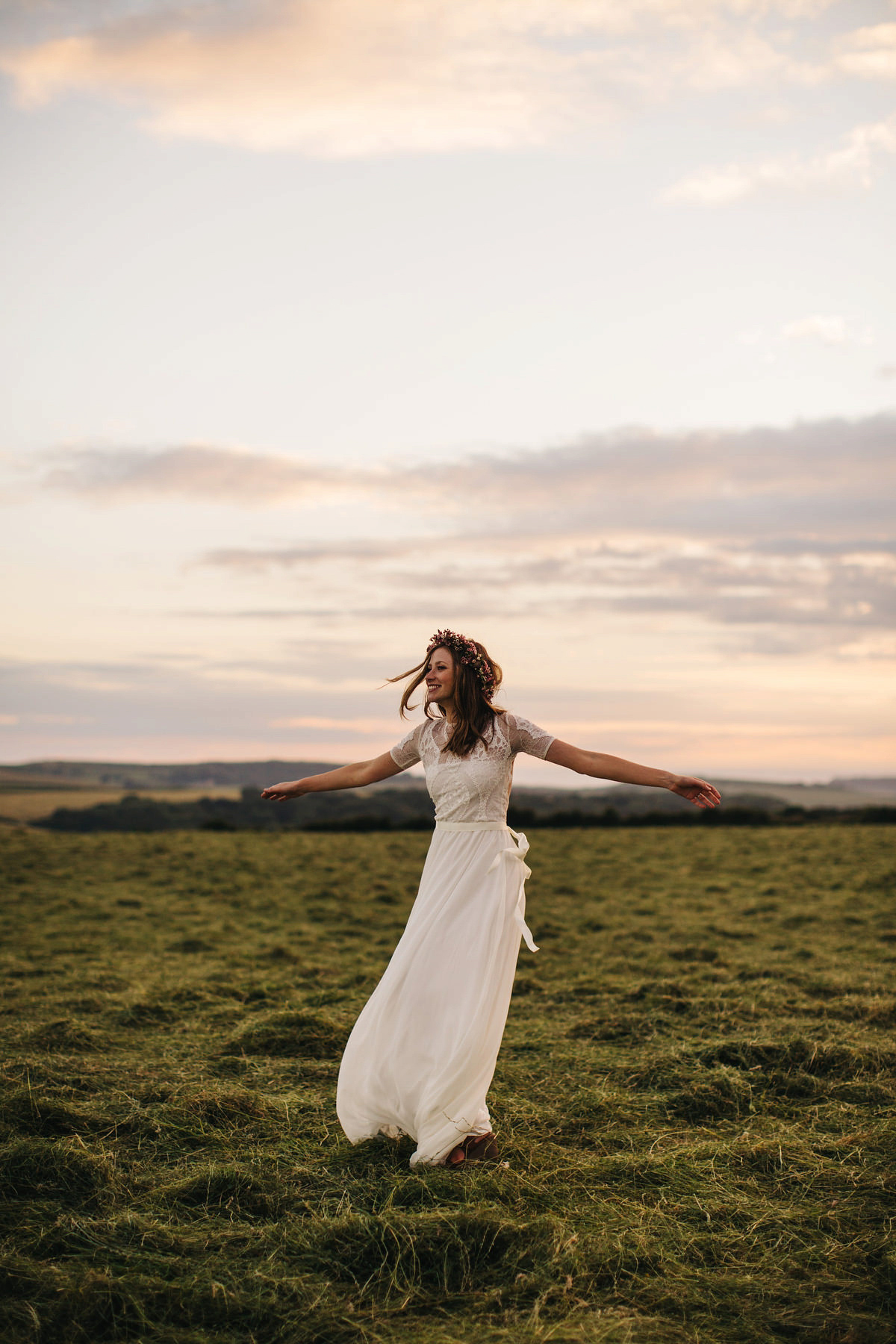 Sarah wore a Grace Loves Lace dress for her rustic Dorset barn wedding with paper cranes. Photography by Richard Skins.