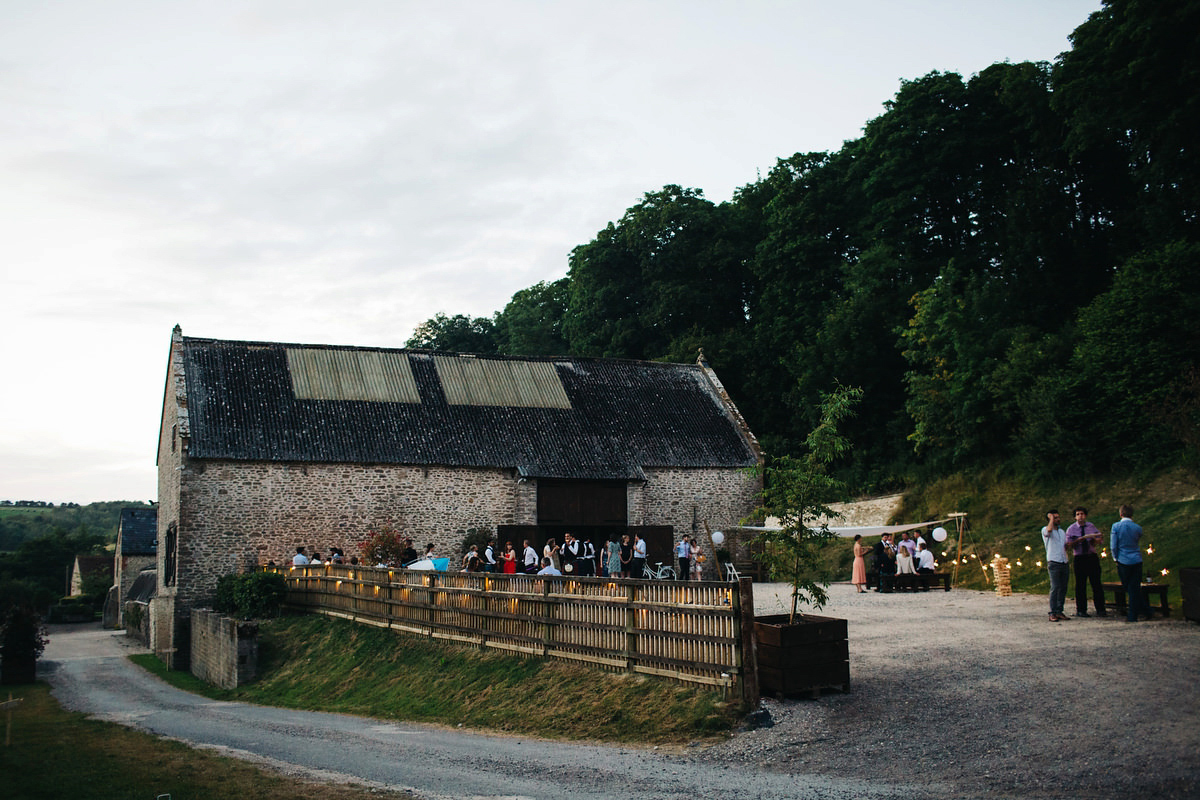 Sarah wore a Grace Loves Lace dress for her rustic Dorset barn wedding with paper cranes. Photography by Richard Skins.