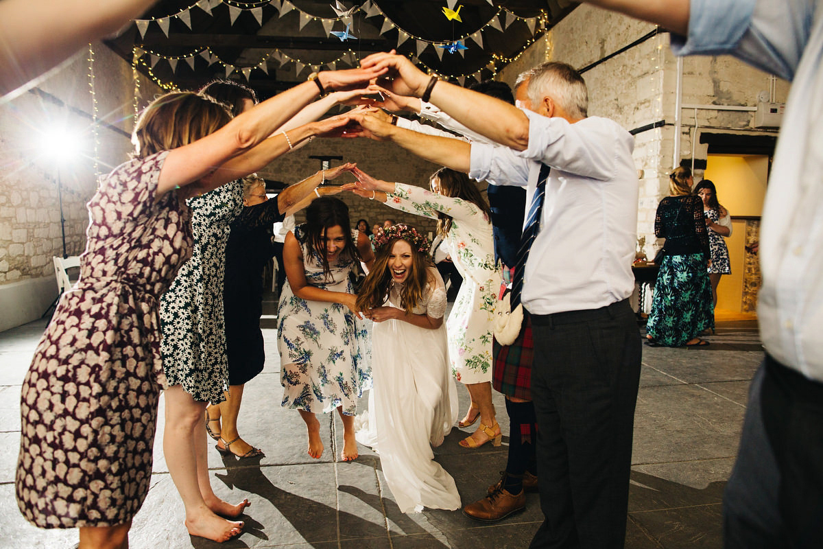 Sarah wore a Grace Loves Lace dress for her rustic Dorset barn wedding with paper cranes. Photography by Richard Skins.
