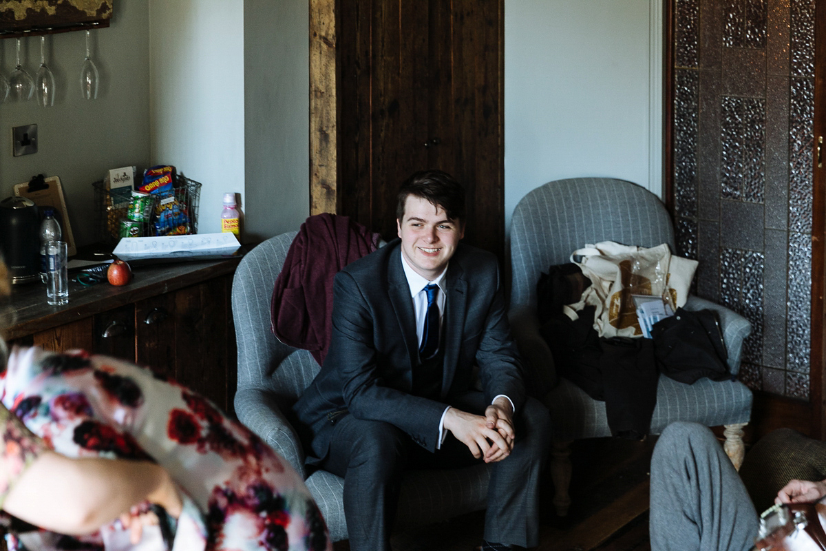 Emma and Marshy had a secret wedding in Brighton. Emma wore a bespoke blue dress by Suzanne Neville. Photography by Nick Tucker.