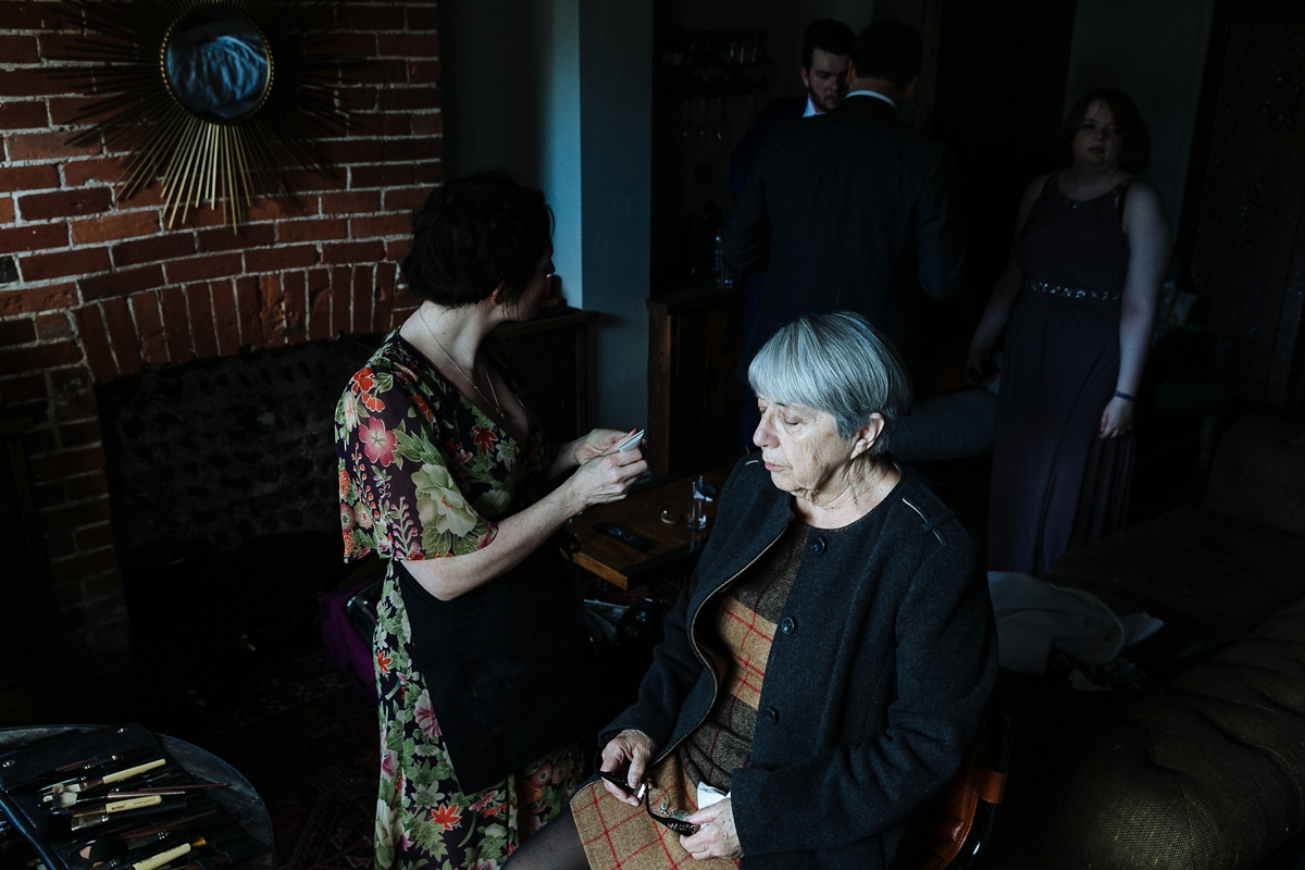 Emma and Marshy had a secret wedding in Brighton. Emma wore a bespoke blue dress by Suzanne Neville. Photography by Nick Tucker.