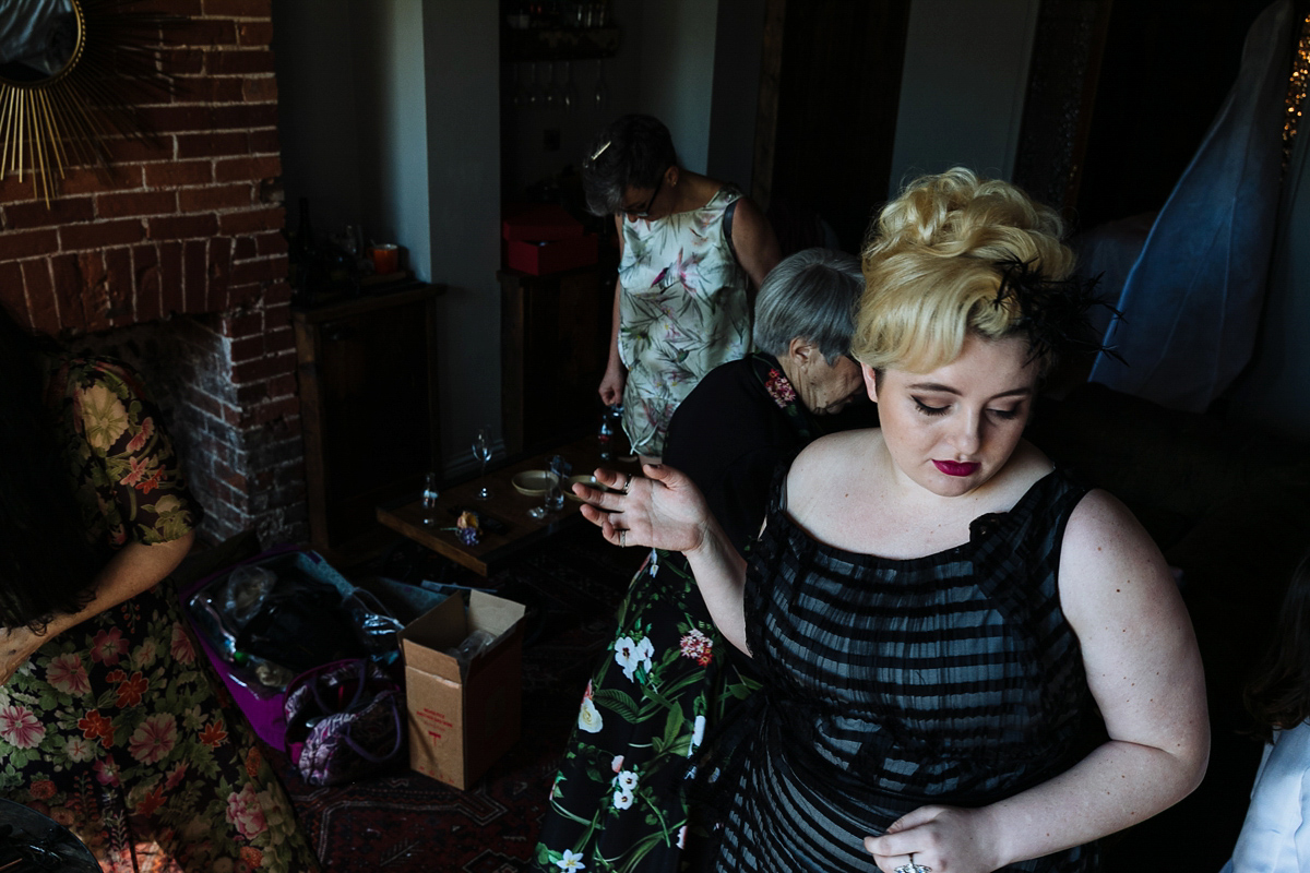 Emma and Marshy had a secret wedding in Brighton. Emma wore a bespoke blue dress by Suzanne Neville. Photography by Nick Tucker.