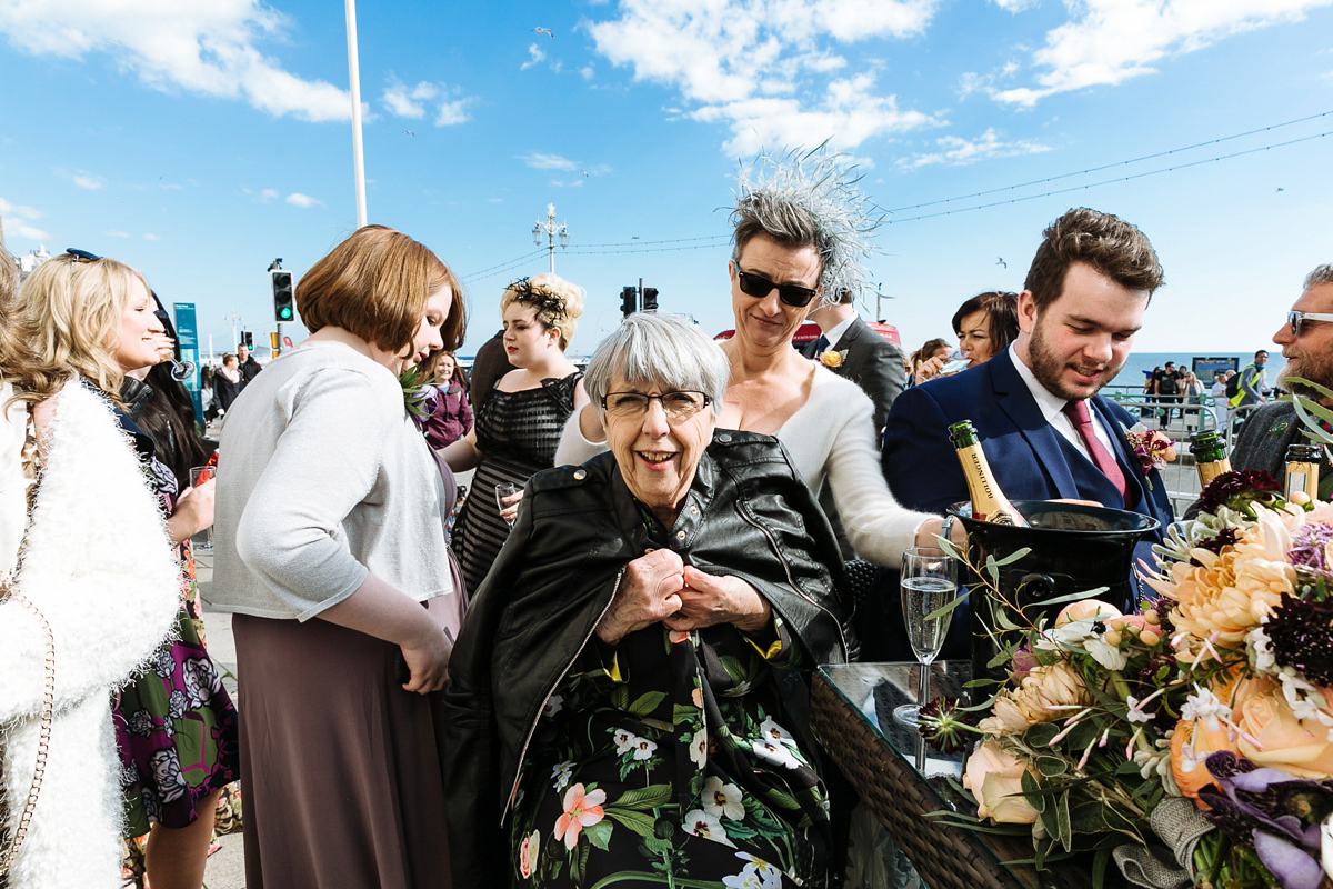 Emma and Marshy had a secret wedding in Brighton. Emma wore a bespoke blue dress by Suzanne Neville. Photography by Nick Tucker.