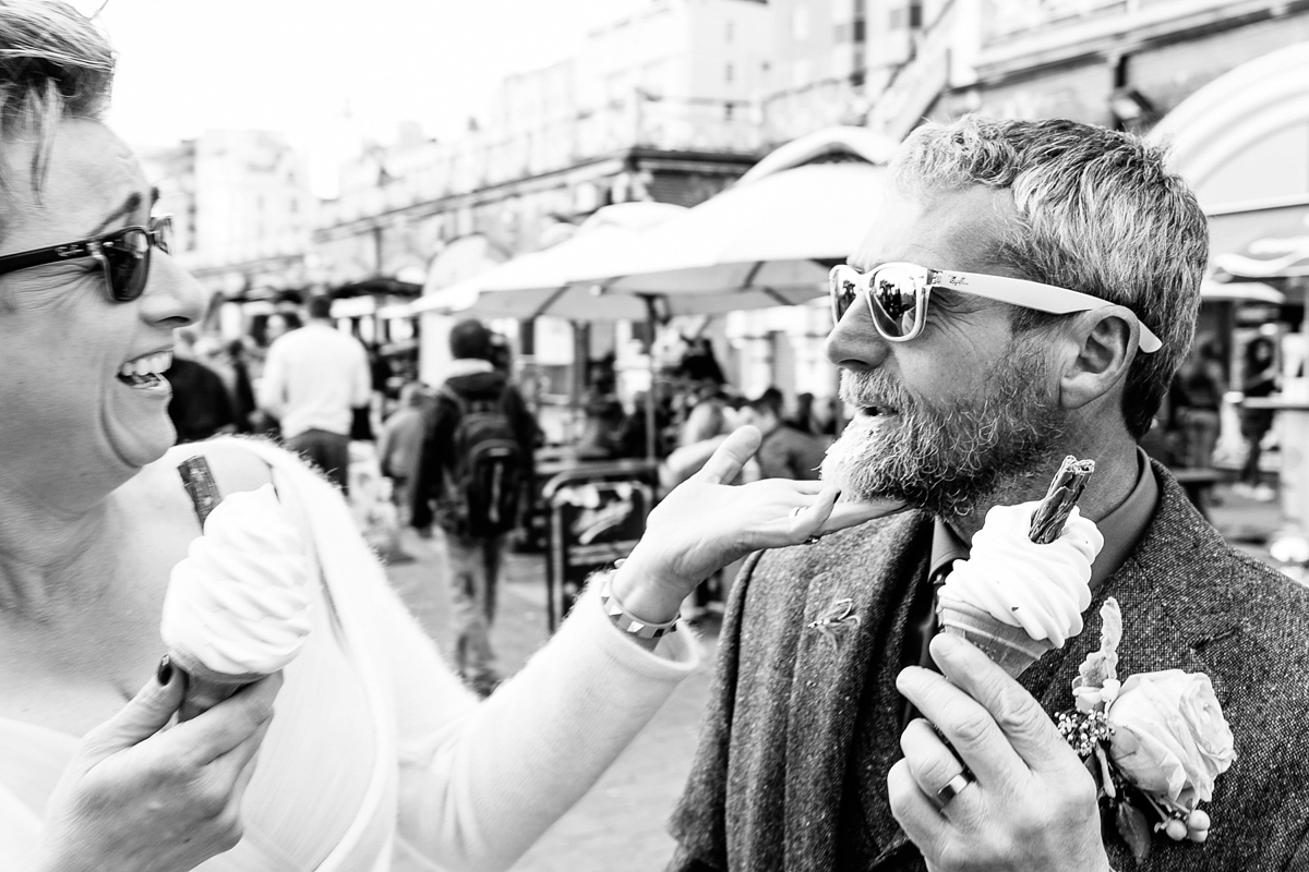 Emma and Marshy had a secret wedding in Brighton. Emma wore a bespoke blue dress by Suzanne Neville. Photography by Nick Tucker.