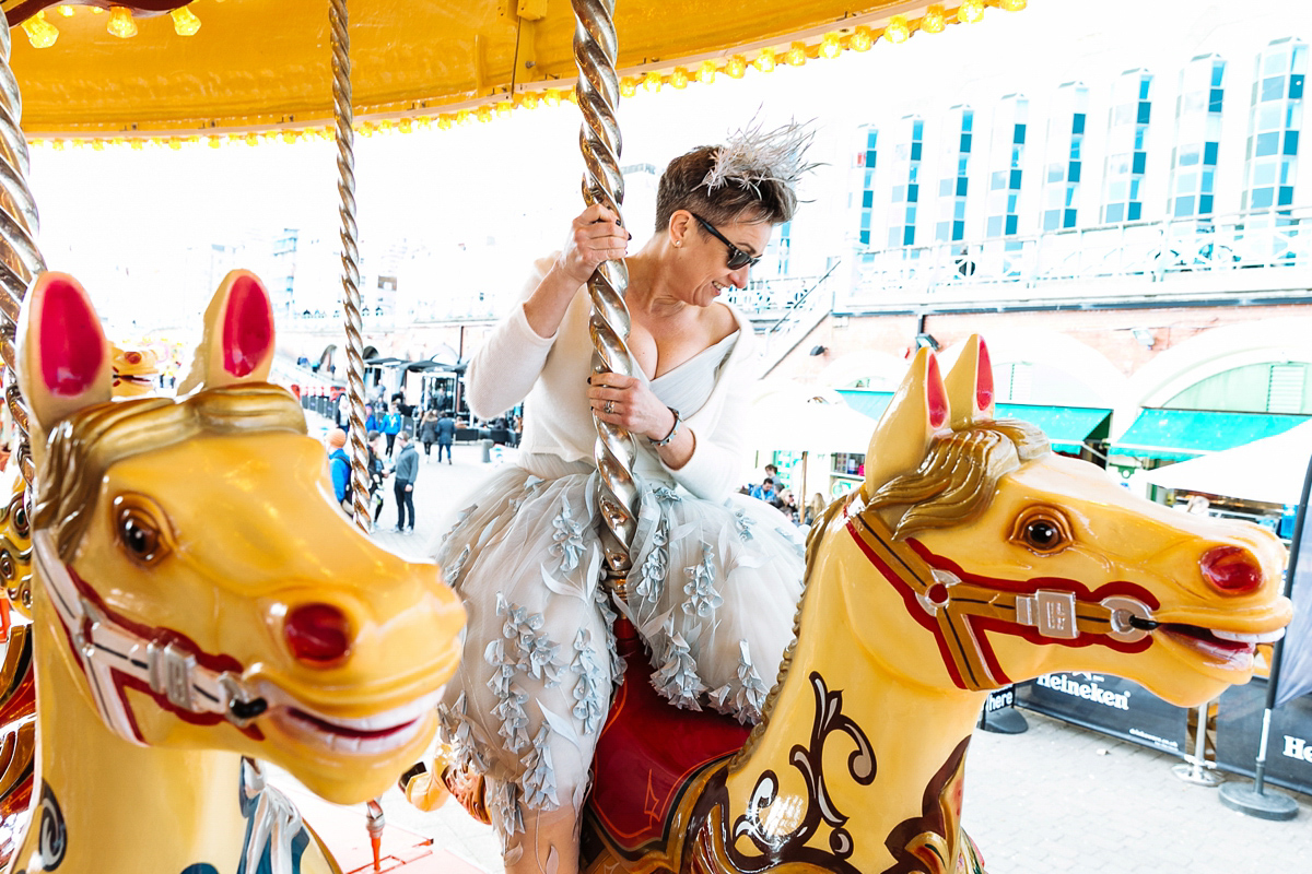 Emma and Marshy had a secret wedding in Brighton. Emma wore a bespoke blue dress by Suzanne Neville. Photography by Nick Tucker.