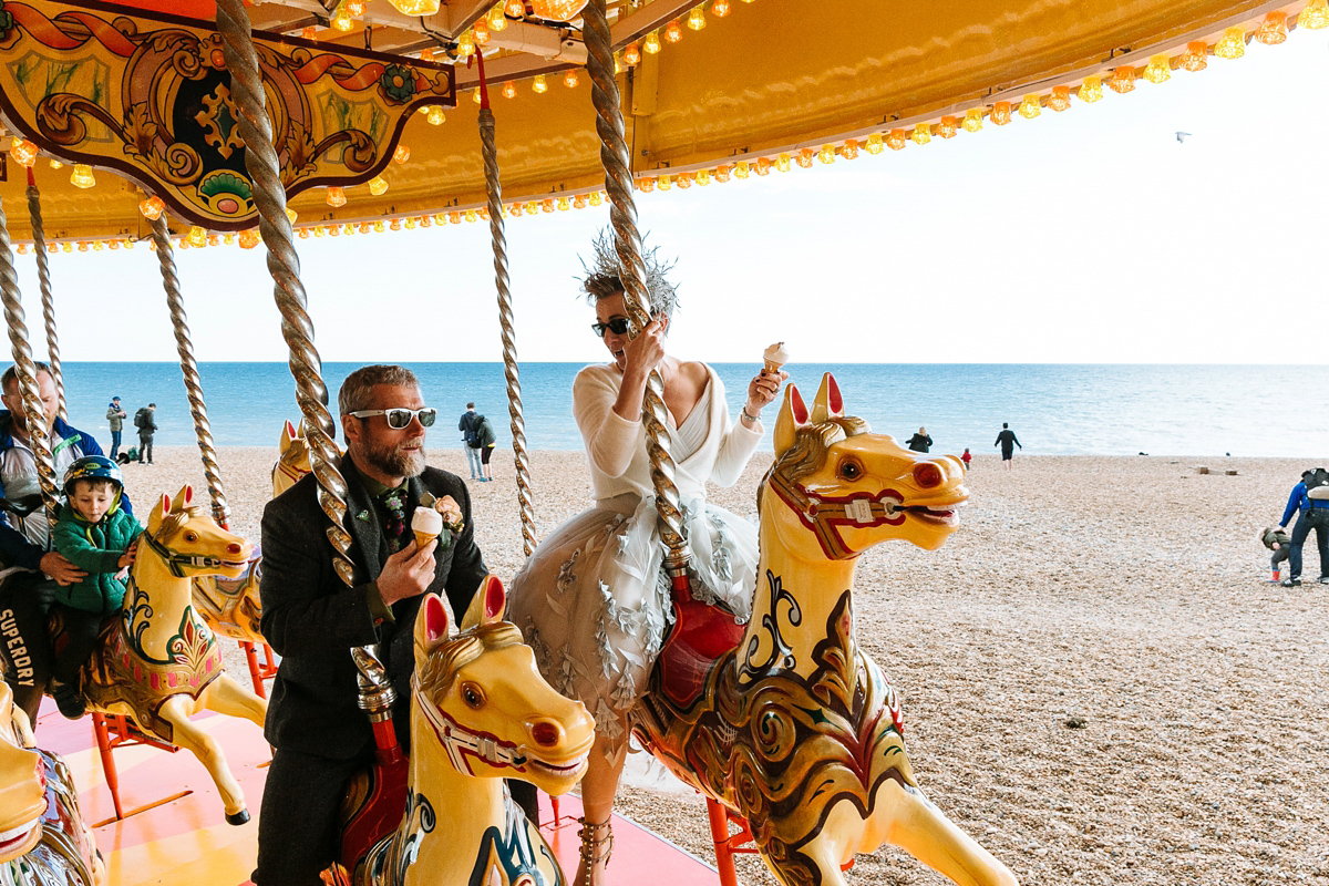 Emma and Marshy had a secret wedding in Brighton. Emma wore a bespoke blue dress by Suzanne Neville. Photography by Nick Tucker.