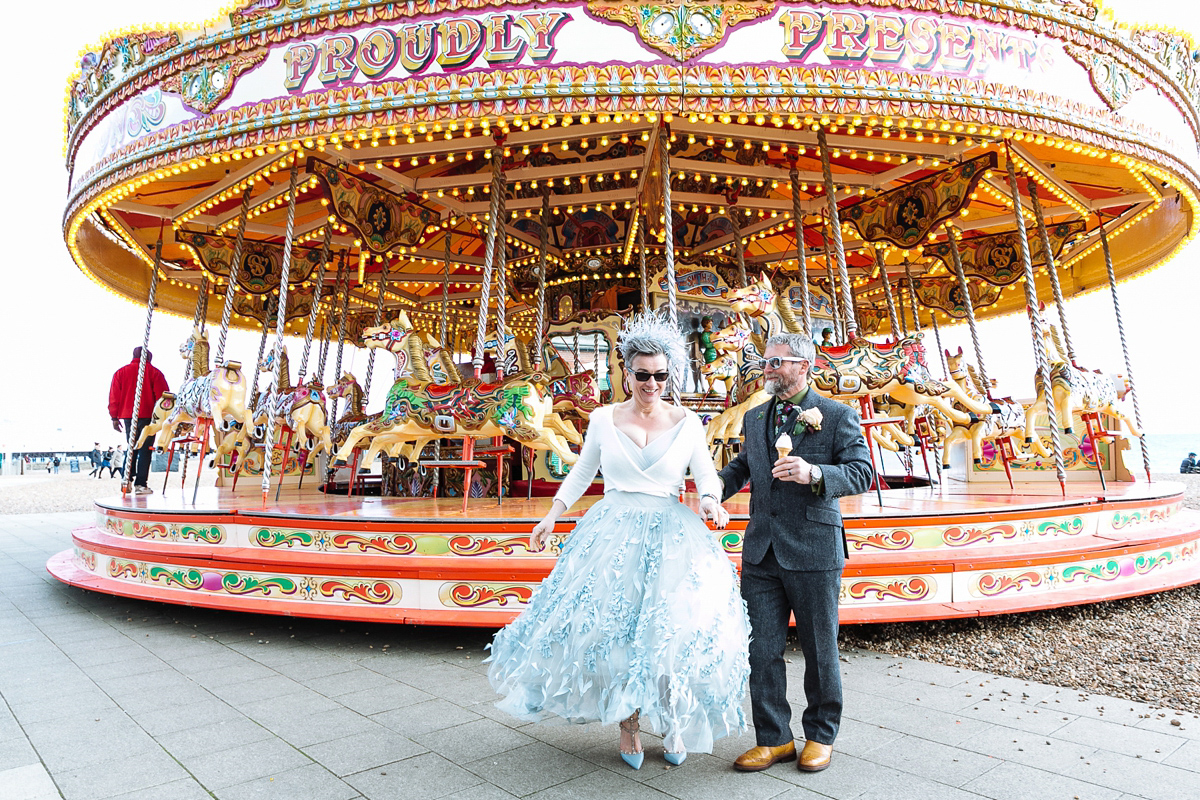 Emma and Marshy had a secret wedding in Brighton. Emma wore a bespoke blue dress by Suzanne Neville. Photography by Nick Tucker.