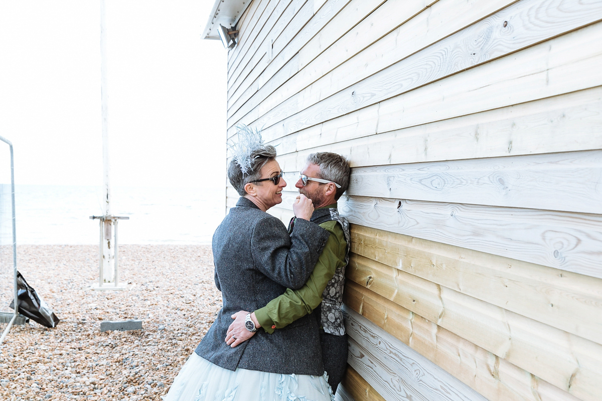 Emma and Marshy had a secret wedding in Brighton. Emma wore a bespoke blue dress by Suzanne Neville. Photography by Nick Tucker.