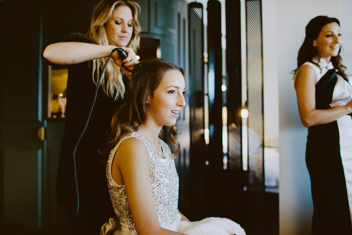 Antonietta wore a chic and elegant long sleeved Suzanne Neville gown for her black tie winter wedding at the RSA in London.