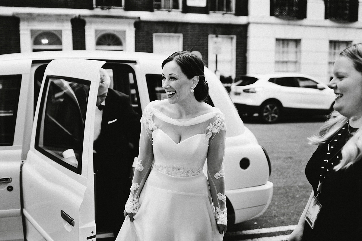 Antonietta wore a chic and elegant long sleeved Suzanne Neville gown for her black tie winter wedding at the RSA in London.