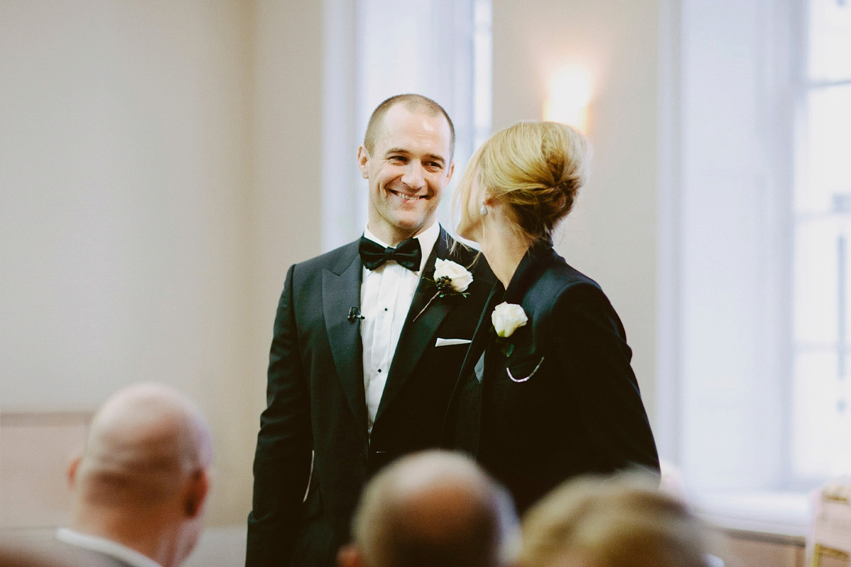 Antonietta wore a chic and elegant long sleeved Suzanne Neville gown for her black tie winter wedding at the RSA in London.