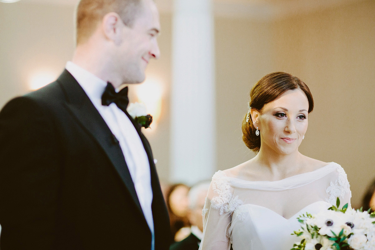 Antonietta wore a chic and elegant long sleeved Suzanne Neville gown for her black tie winter wedding at the RSA in London.