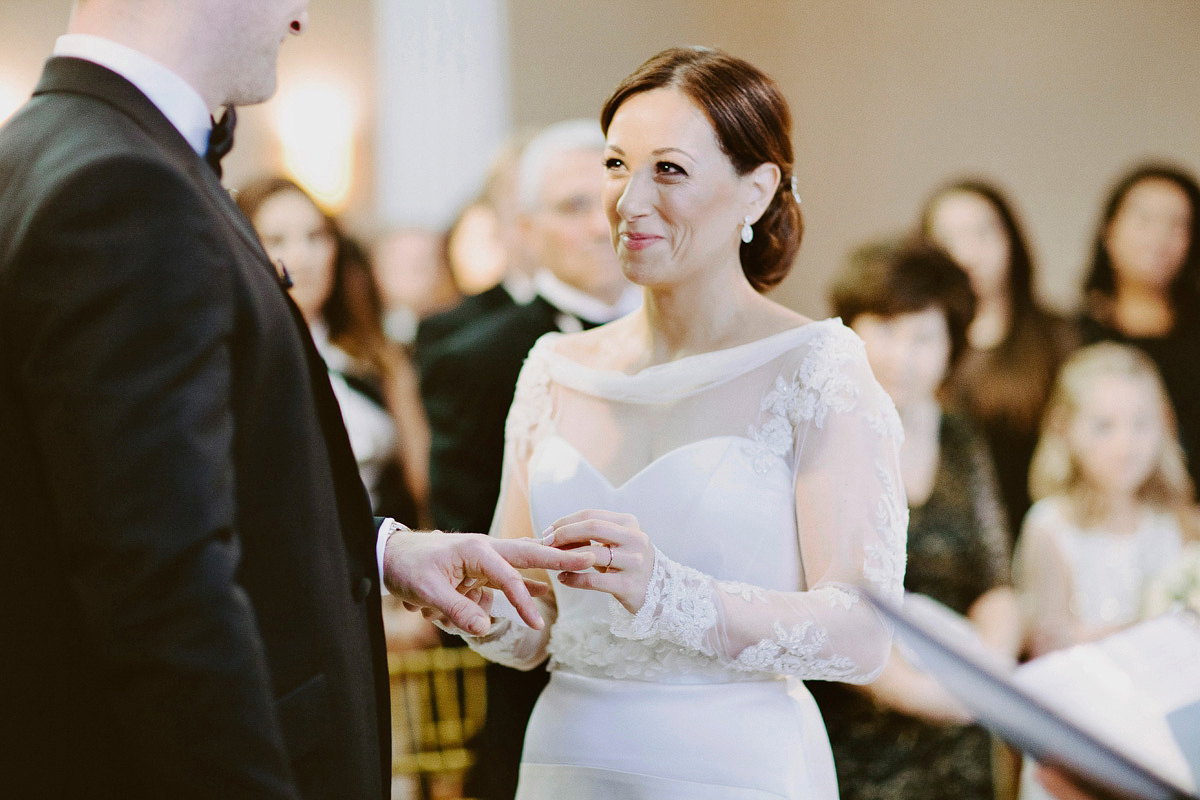 Antonietta wore a chic and elegant long sleeved Suzanne Neville gown for her black tie winter wedding at the RSA in London.