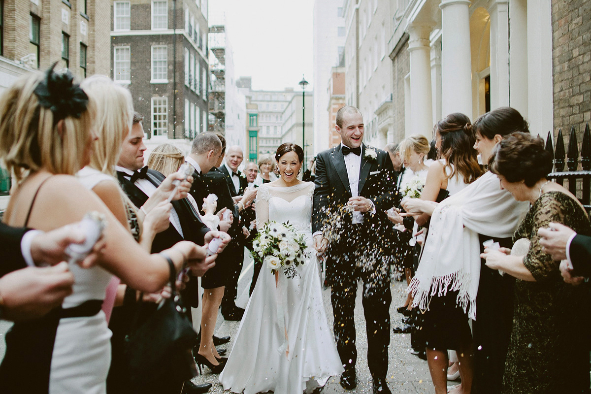 Antonietta wore a chic and elegant long sleeved Suzanne Neville gown for her black tie winter wedding at the RSA in London.