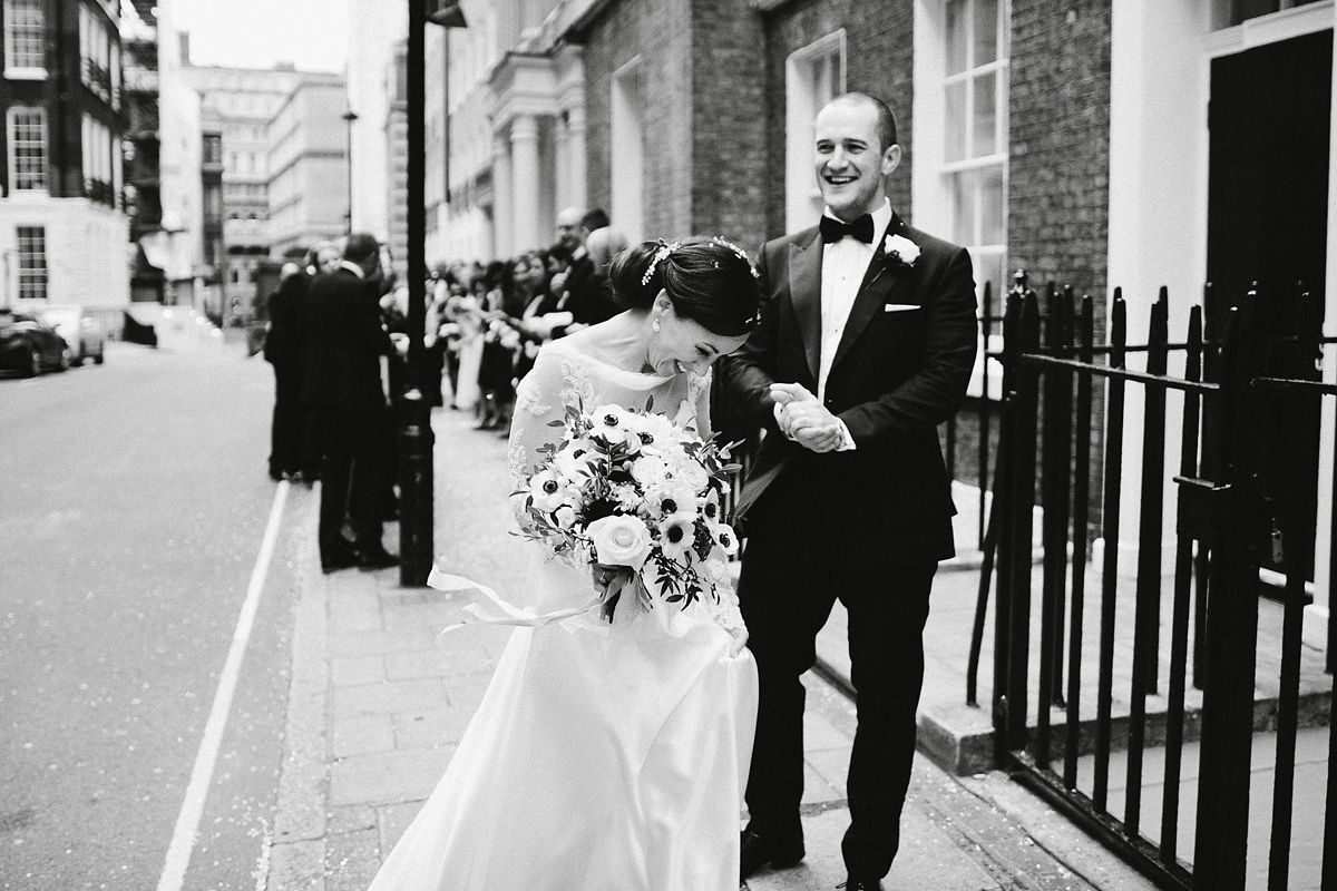 Antonietta wore a chic and elegant long sleeved Suzanne Neville gown for her black tie winter wedding at the RSA in London.