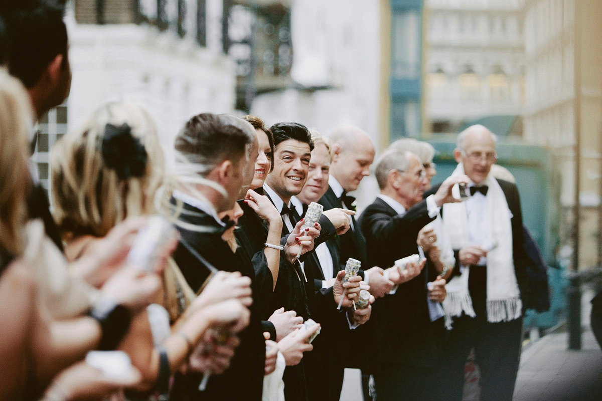 Antonietta wore a chic and elegant long sleeved Suzanne Neville gown for her black tie winter wedding at the RSA in London.