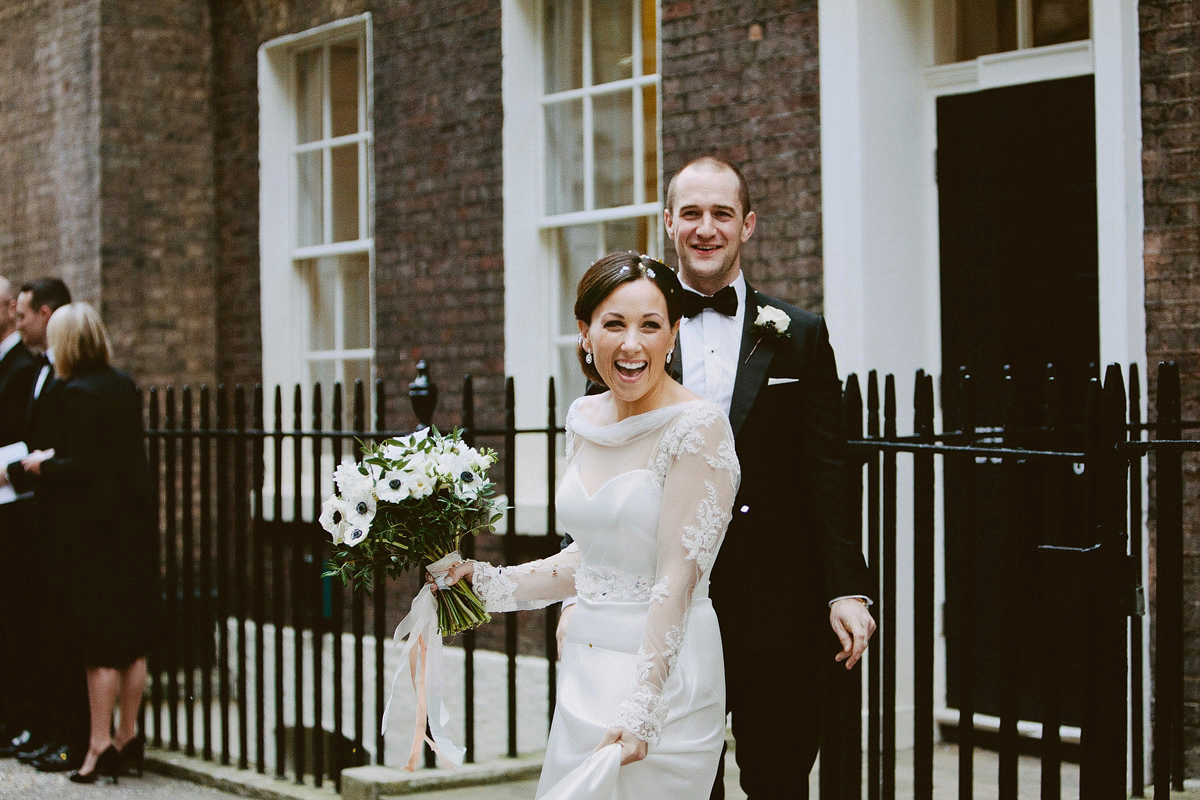 Antonietta wore a chic and elegant long sleeved Suzanne Neville gown for her black tie winter wedding at the RSA in London.