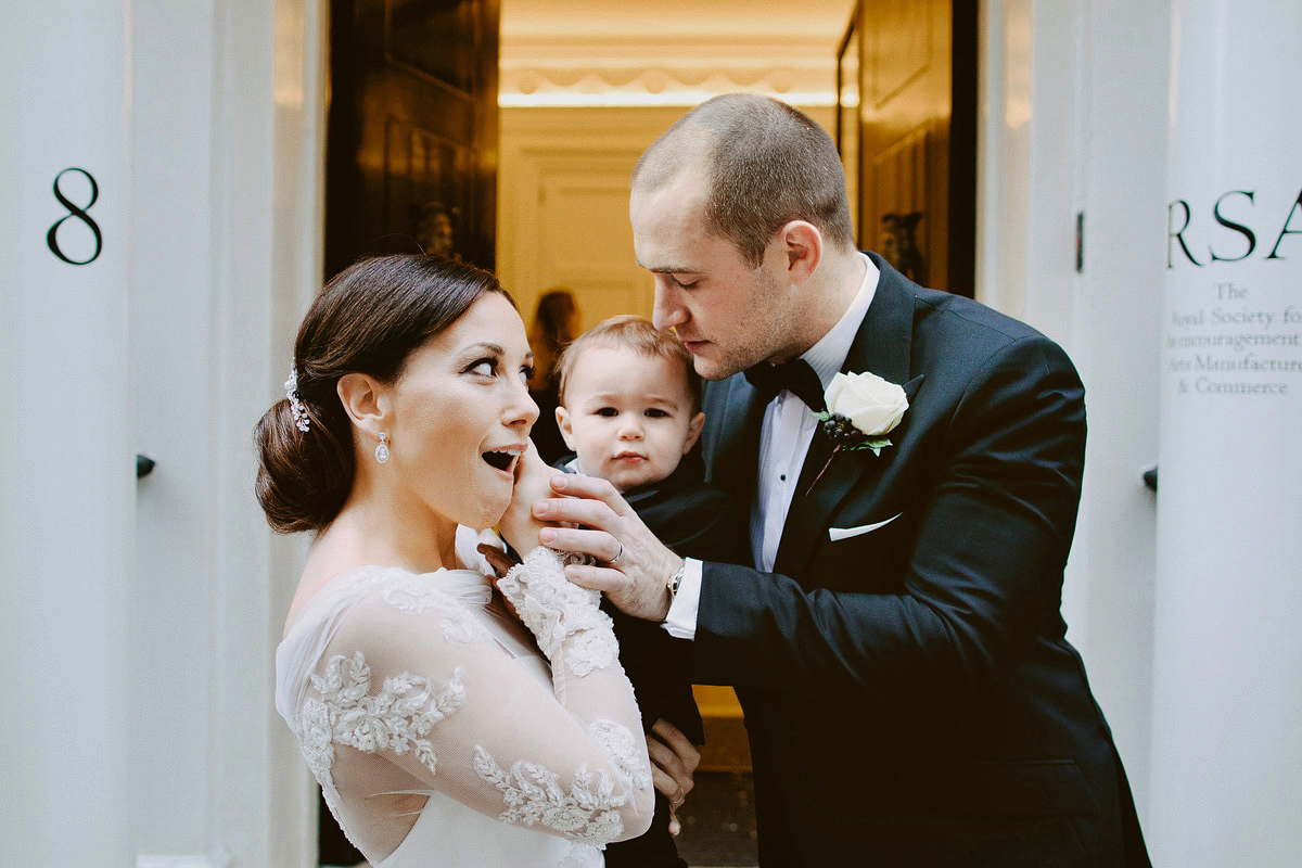 Antonietta wore a chic and elegant long sleeved Suzanne Neville gown for her black tie winter wedding at the RSA in London.