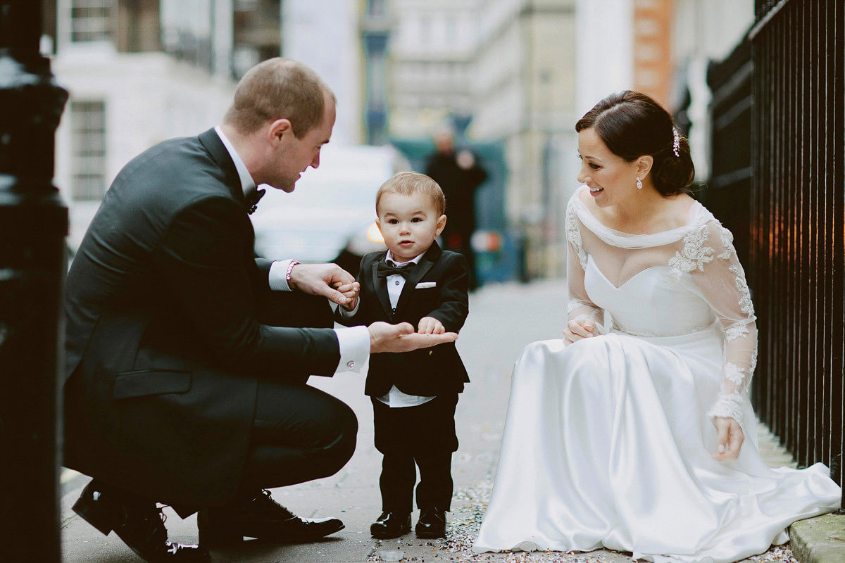 Antonietta wore a chic and elegant long sleeved Suzanne Neville gown for her black tie winter wedding at the RSA in London.