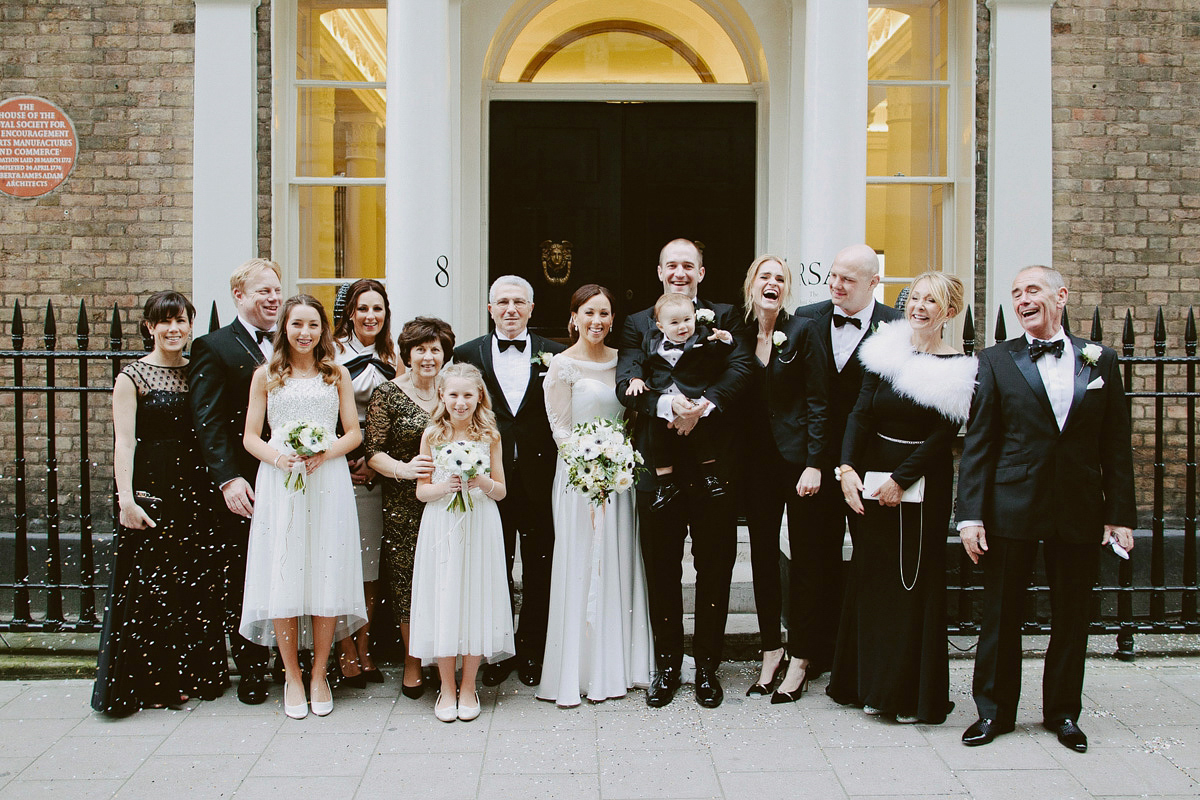 Antonietta wore a chic and elegant long sleeved Suzanne Neville gown for her black tie winter wedding at the RSA in London.