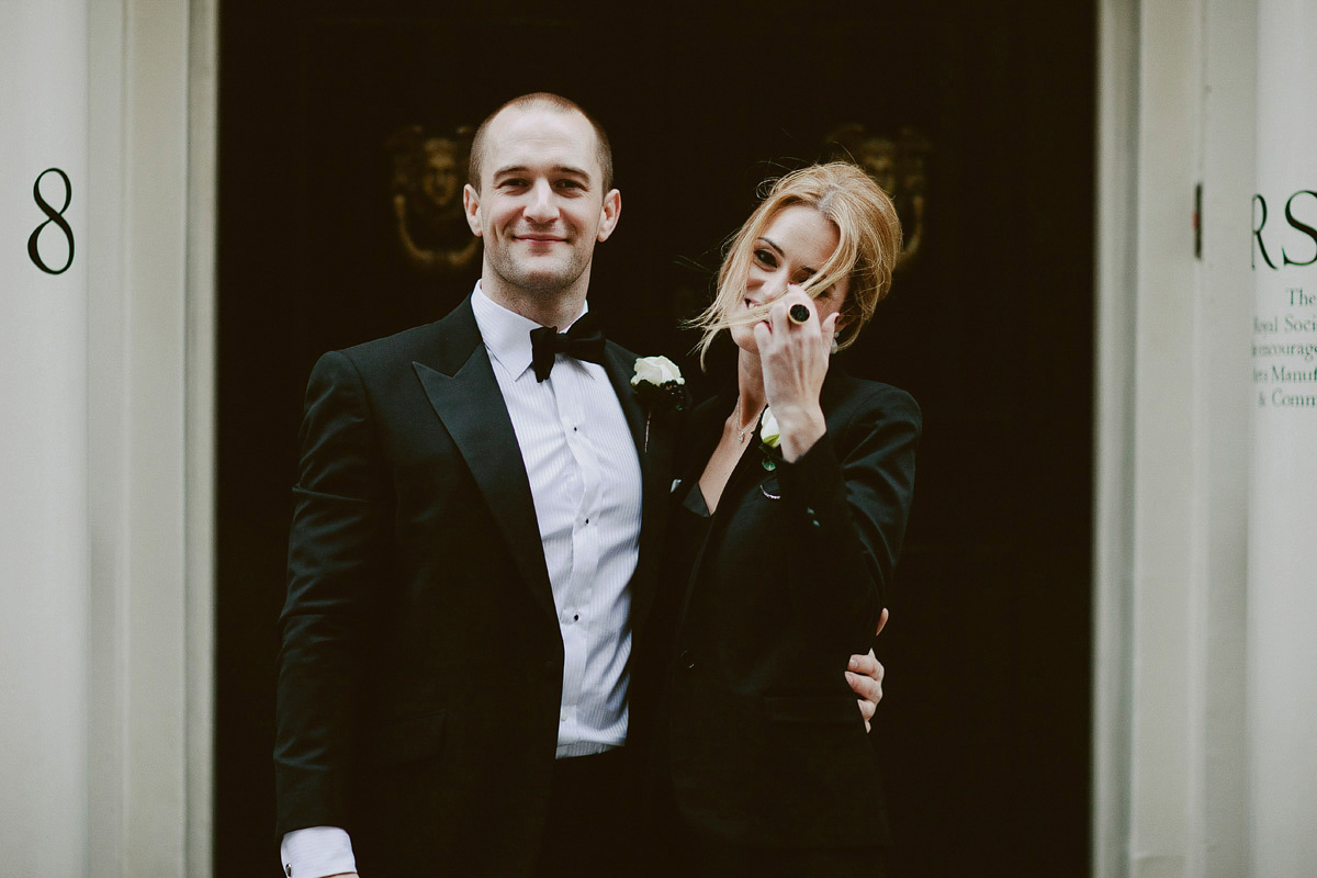 Antonietta wore a chic and elegant long sleeved Suzanne Neville gown for her black tie winter wedding at the RSA in London.