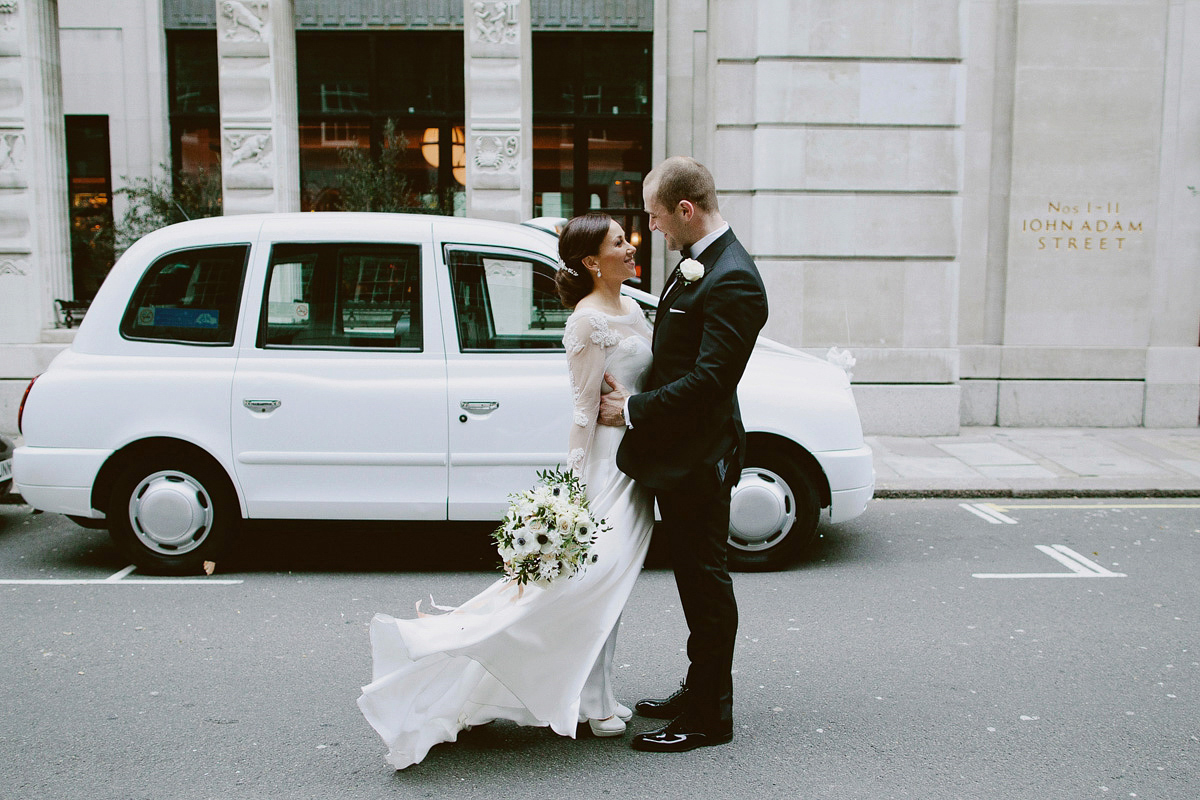 Antonietta wore a chic and elegant long sleeved Suzanne Neville gown for her black tie winter wedding at the RSA in London.