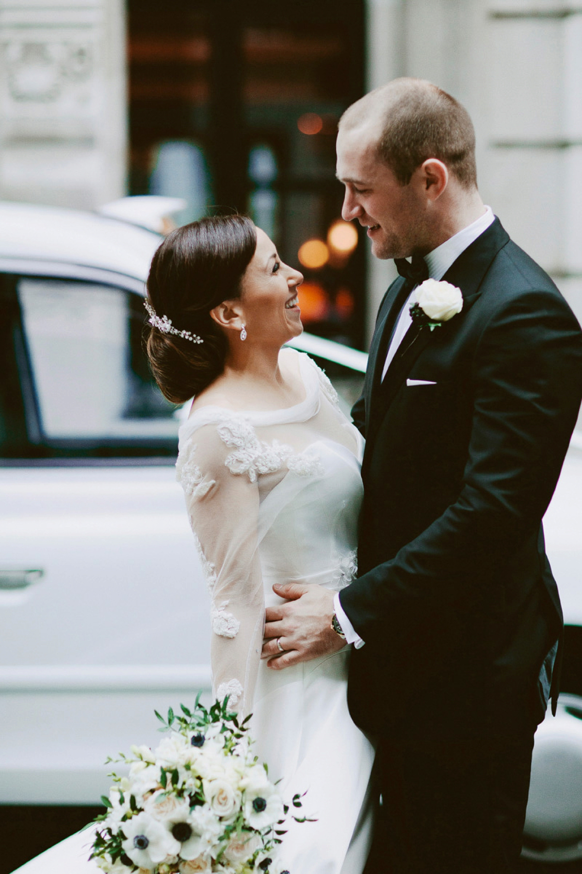 Antonietta wore a chic and elegant long sleeved Suzanne Neville gown for her black tie winter wedding at the RSA in London.