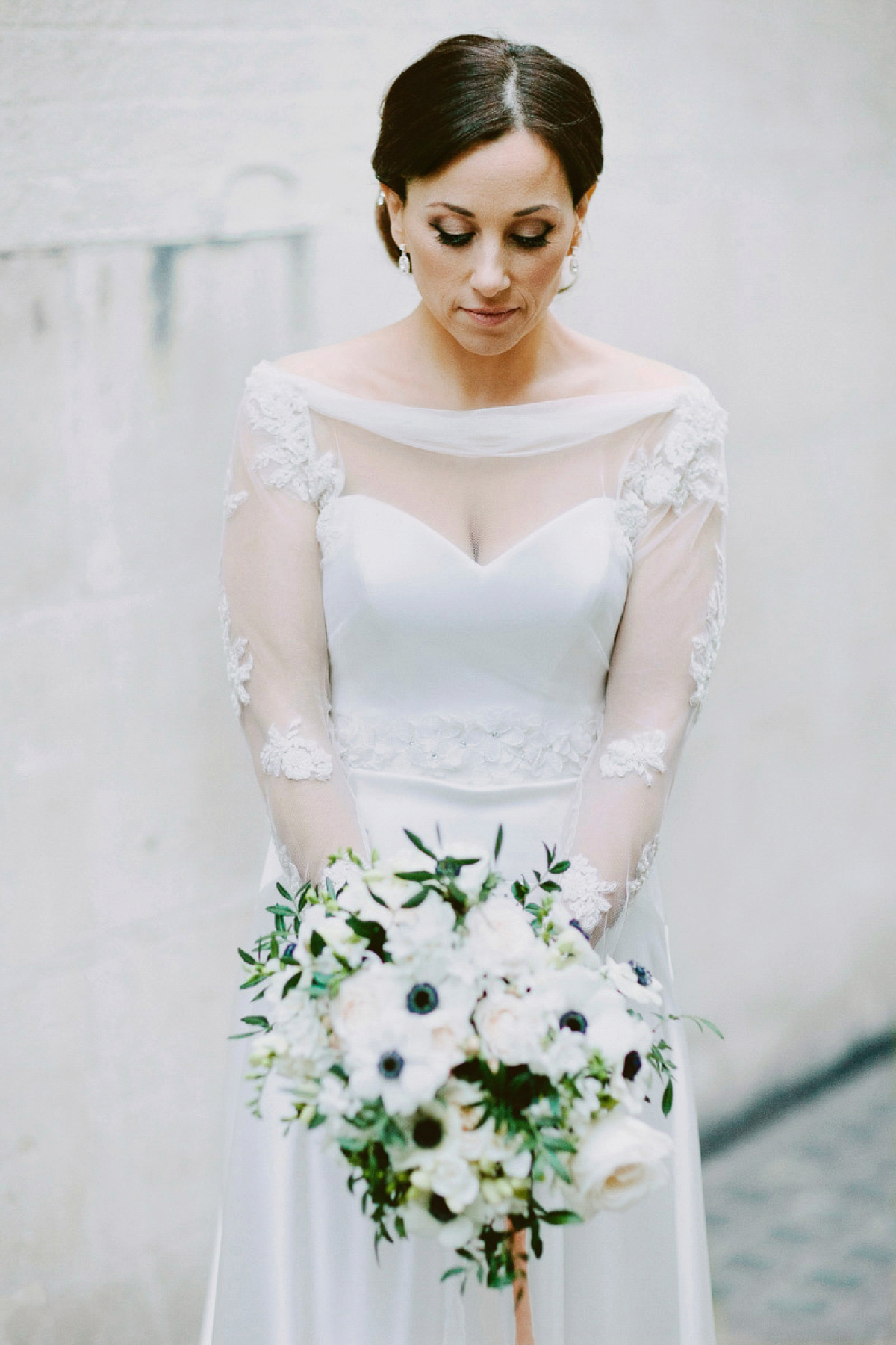 Antonietta wore a chic and elegant long sleeved Suzanne Neville gown for her black tie winter wedding at the RSA in London.