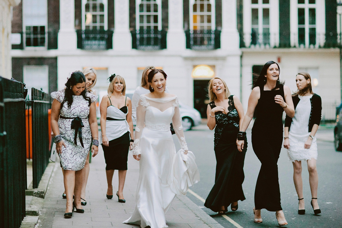 Antonietta wore a chic and elegant long sleeved Suzanne Neville gown for her black tie winter wedding at the RSA in London.