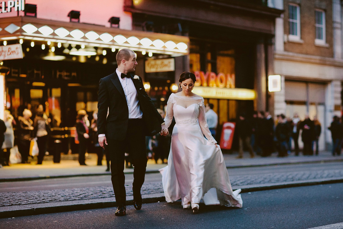 Antonietta wore a chic and elegant long sleeved Suzanne Neville gown for her black tie winter wedding at the RSA in London.