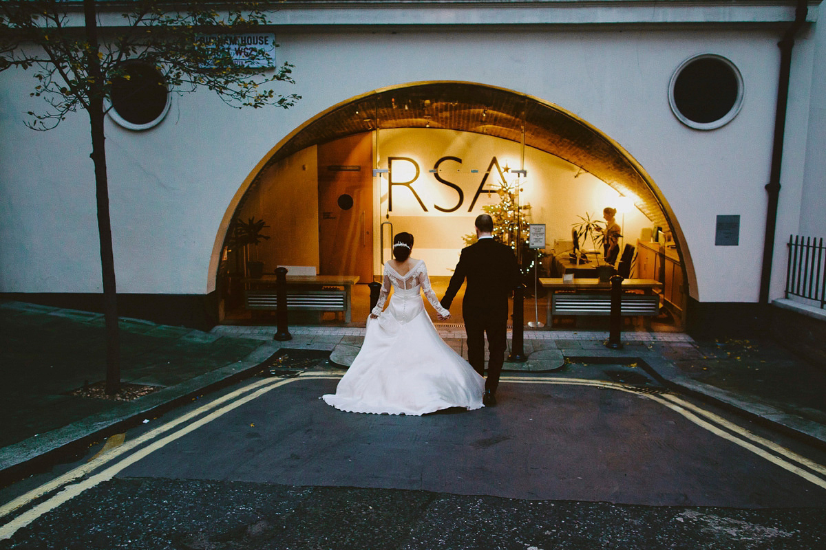 Antonietta wore a chic and elegant long sleeved Suzanne Neville gown for her black tie winter wedding at the RSA in London.